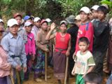 Phou Sai community members clearing the track